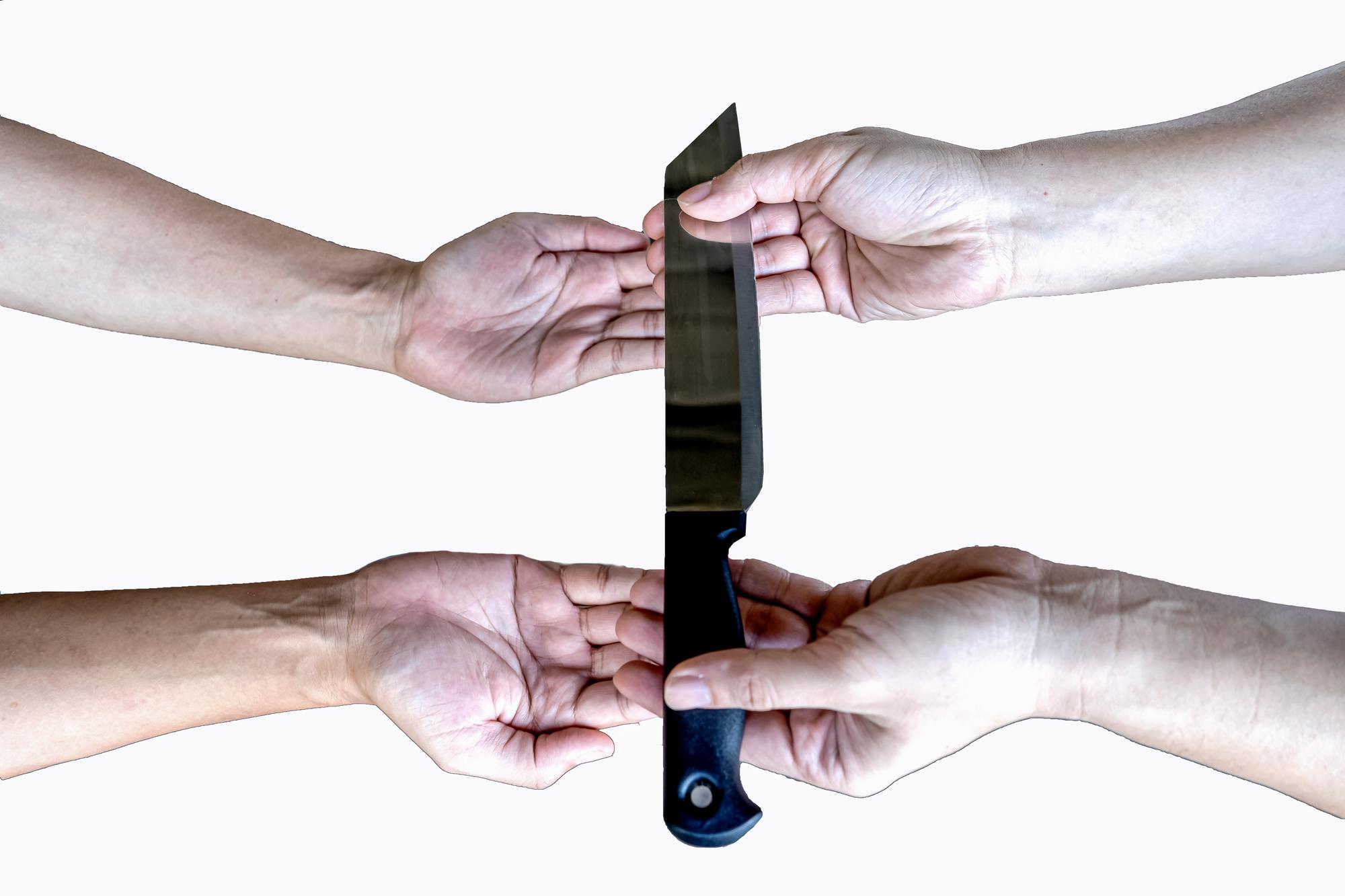 Instructor showing knife skills to a group
